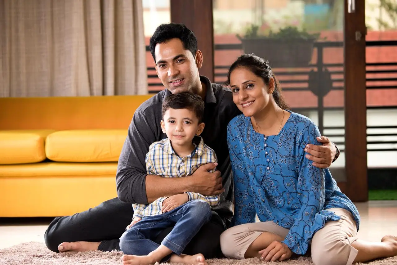 Family of three sitting together at home